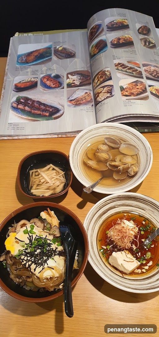 Dining Table with Japanese Cuisine and Menu Book