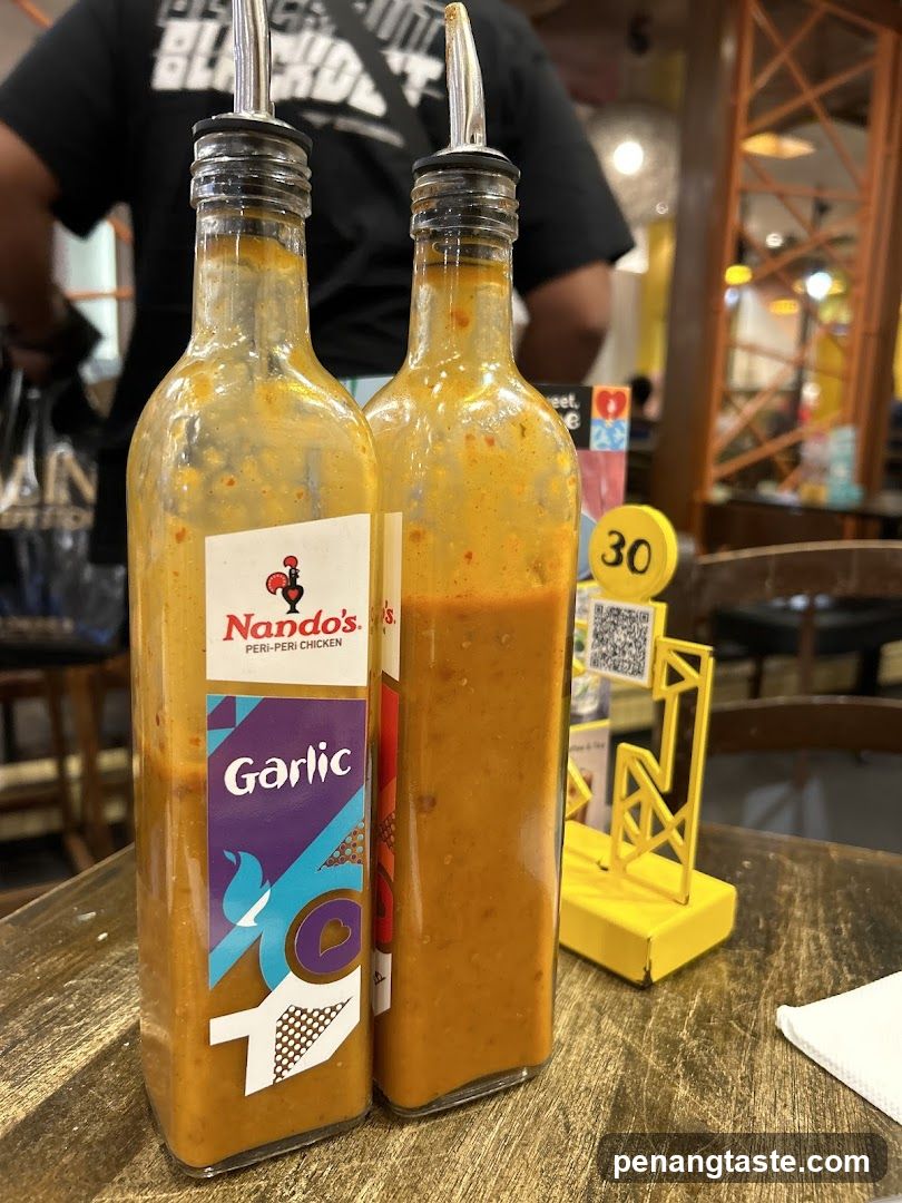 Nando's Garlic Sauce Bottles