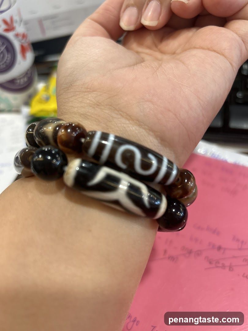 Hand with beaded bracelet on wrist