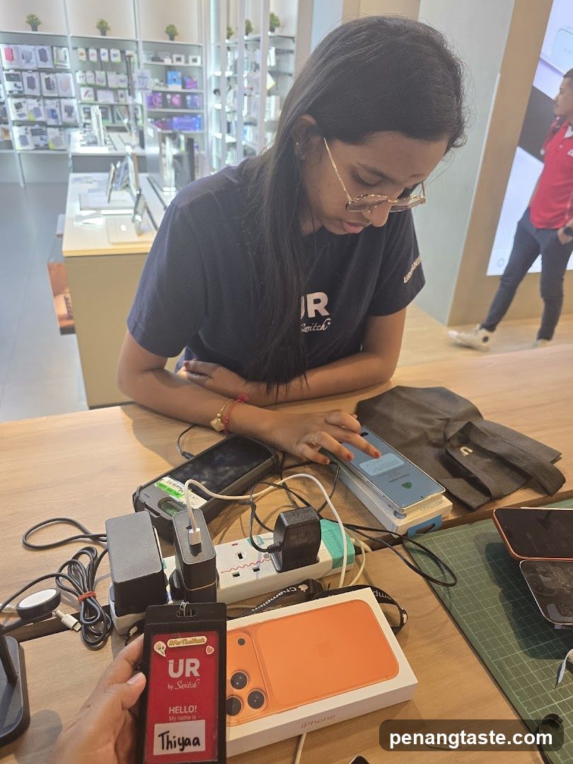 Tech Store Interior with Staff and Products