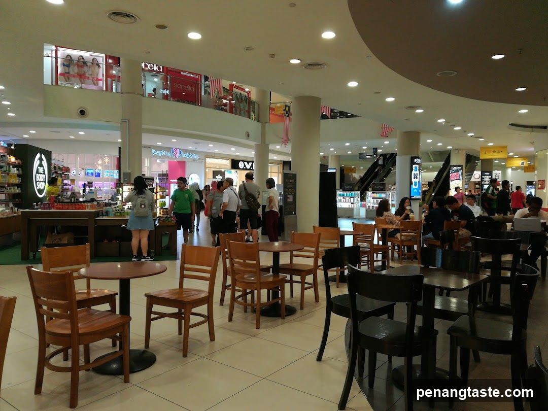 Mall Interior with Dining Area and Storefronts
