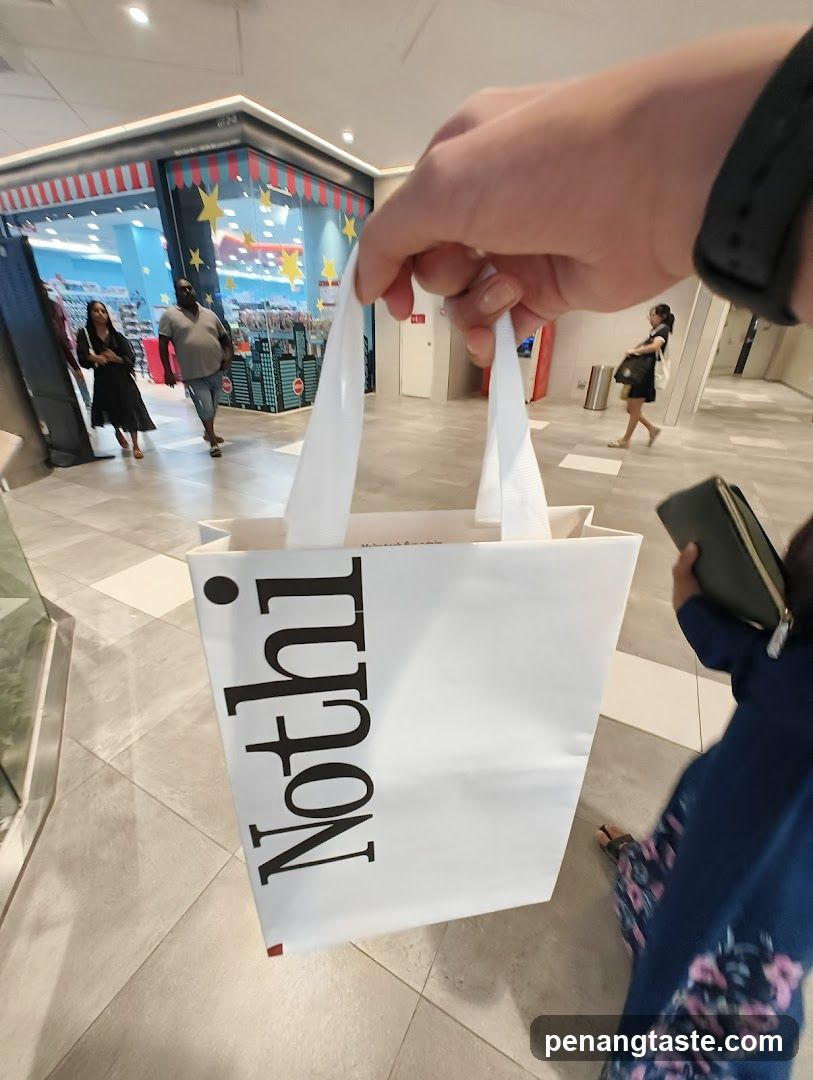 Shopping Bag in Mall Corridor
