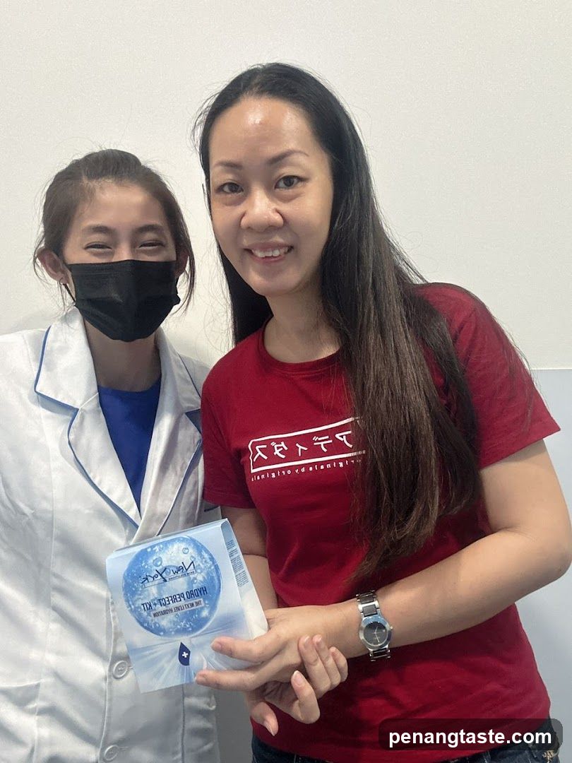 Two women holding a product package