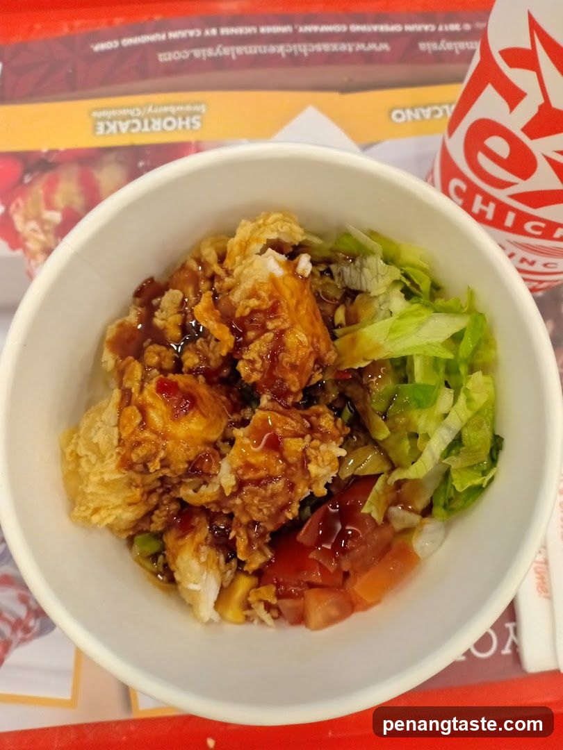 Bowl of Fried Chicken with Lettuce and Sauce