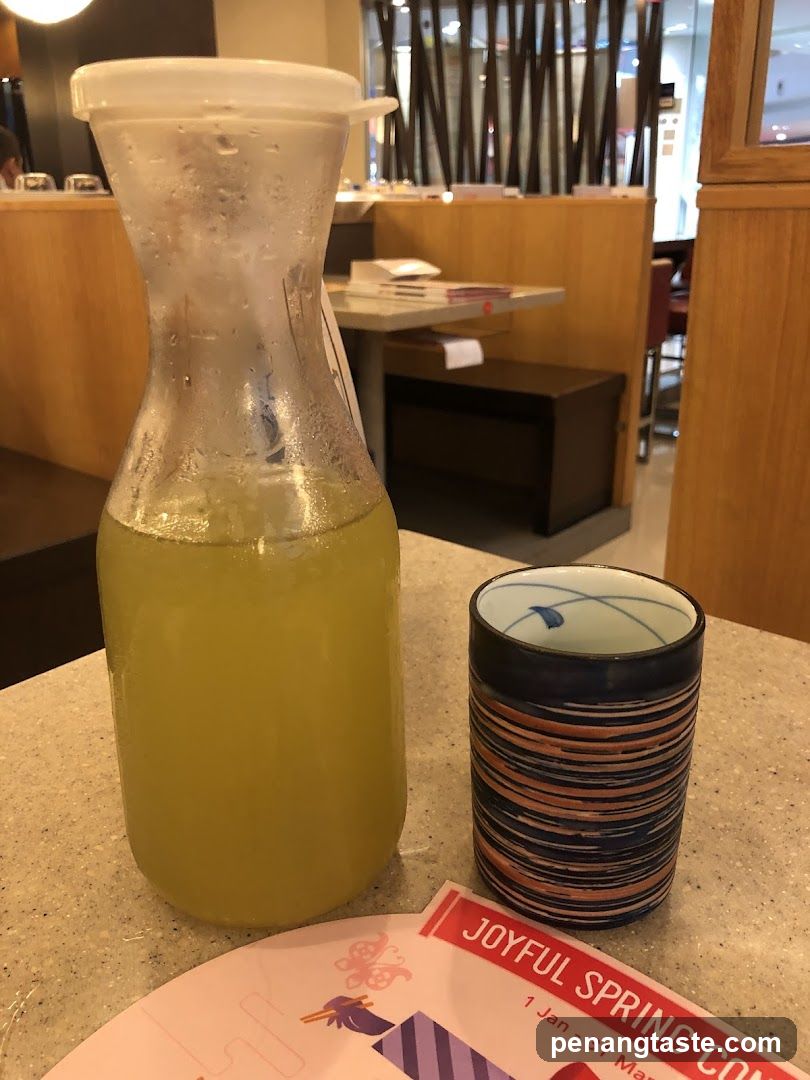 Yellow Drink and Cup on Table