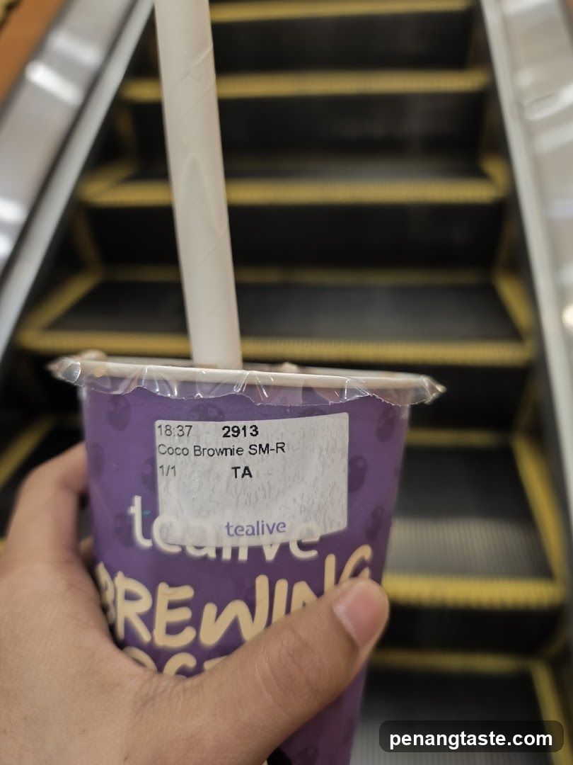 Tealive Cup with Escalator Background