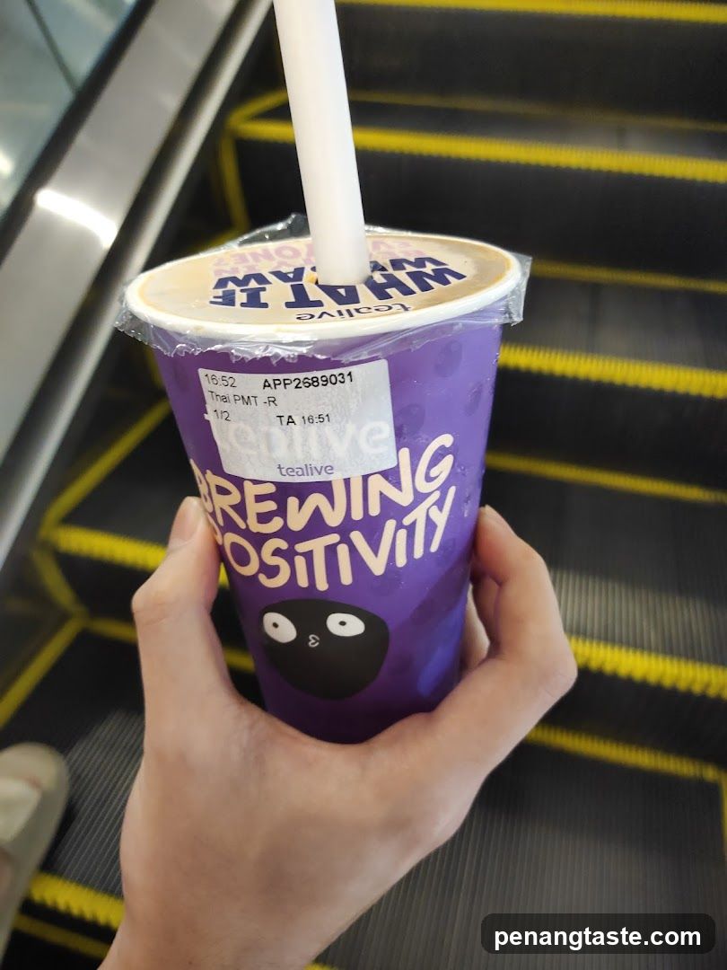 Tealive Cup on Escalator