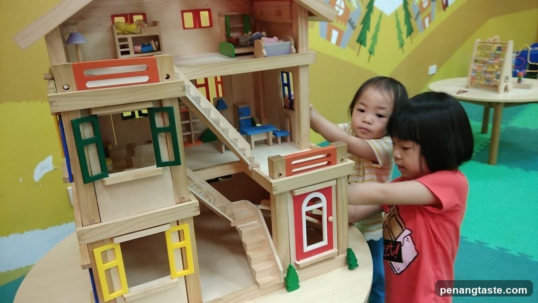 Children Playing with Wooden Dollhouse