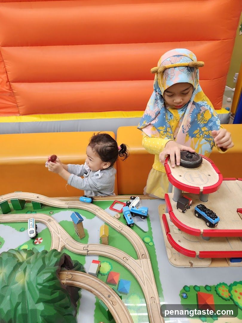 Children Playing with Toy Train Set