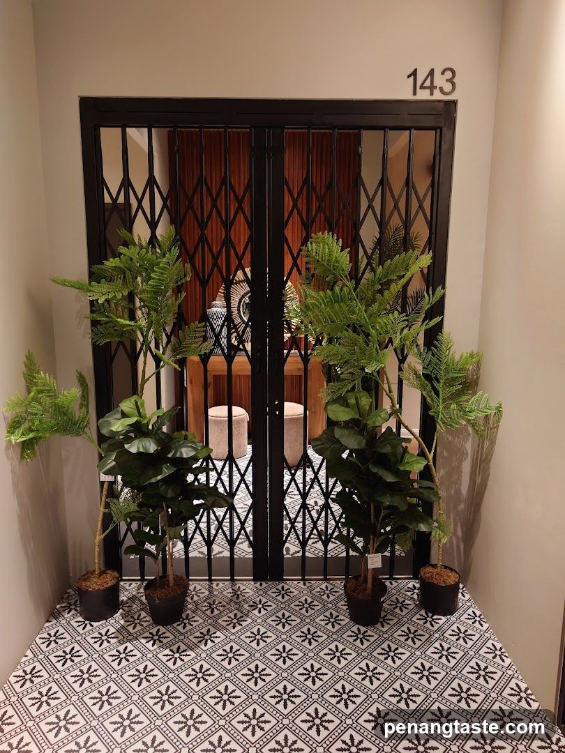 Entrance with Security Gate and Plants