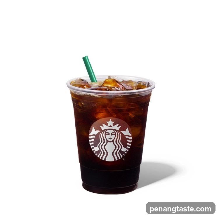 Iced Coffee with Ice Cubes and Green Straw