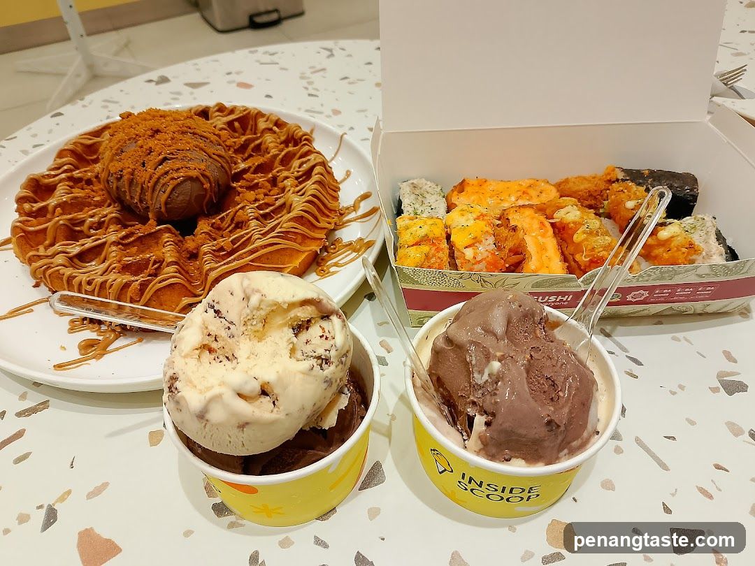 Food spread with waffle, sushi, and ice cream