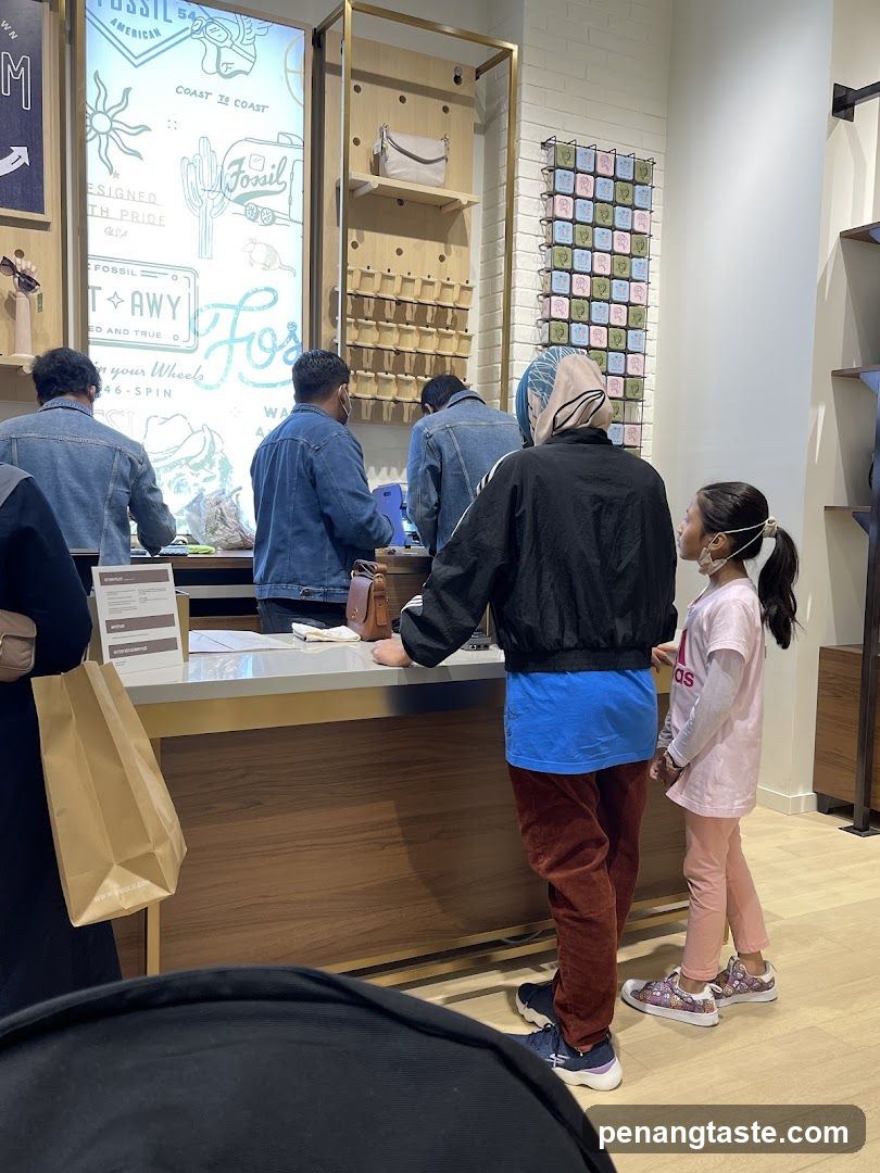 Interior of a retail store with customers at counter