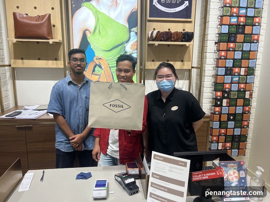 Fossil Store Interior with Staff and Customers