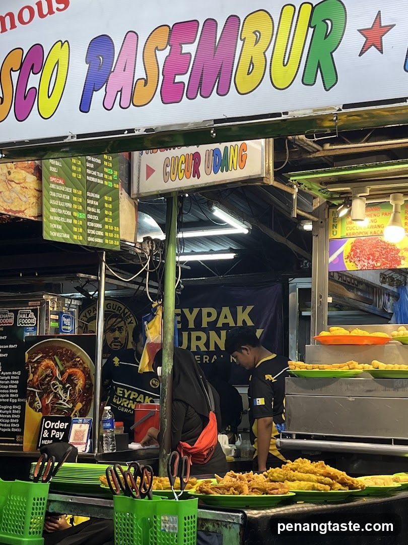 Street Food Stall with Menu Board and Staff