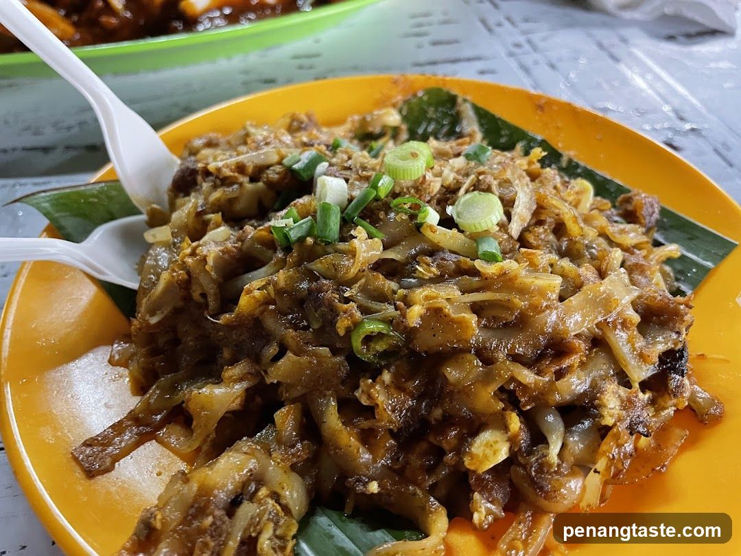 Nasi Lemak or similar dish on a yellow plate