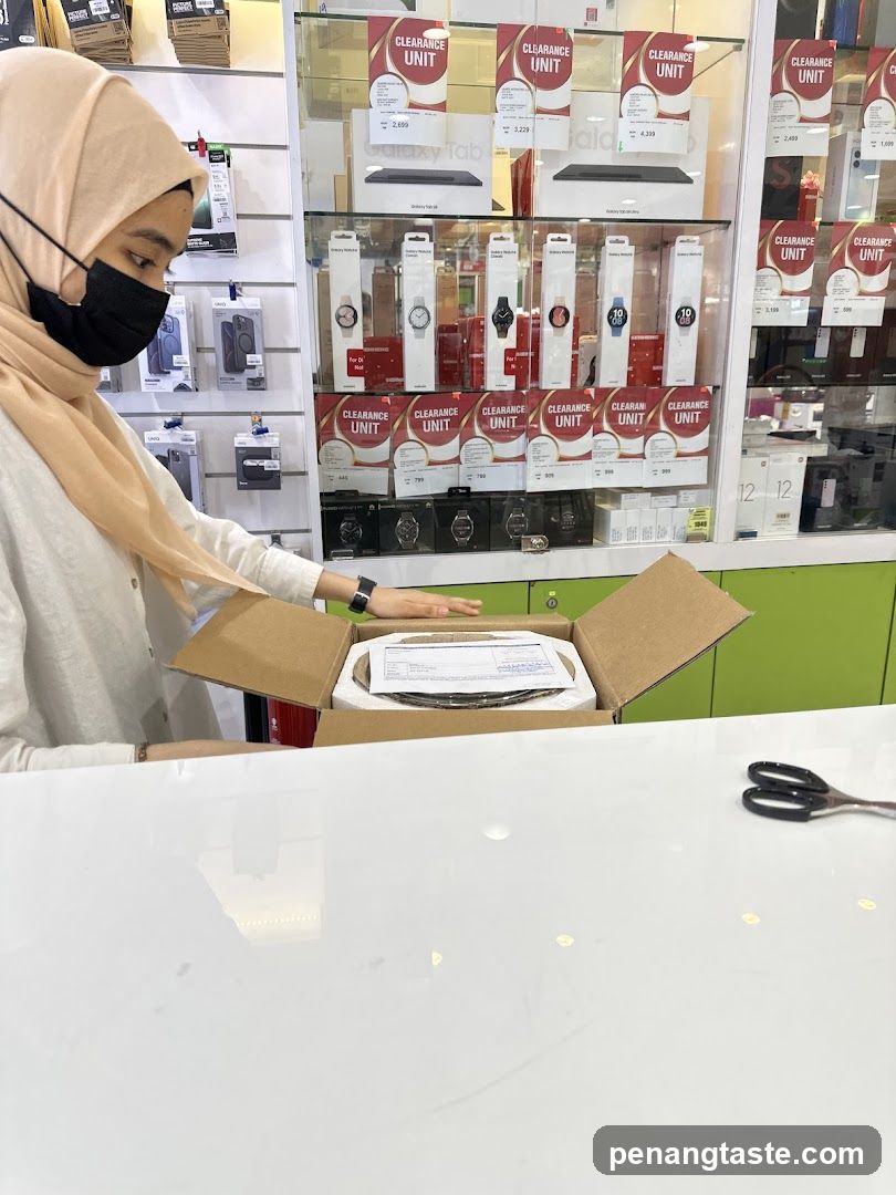 Customer Unboxing in Electronics Store