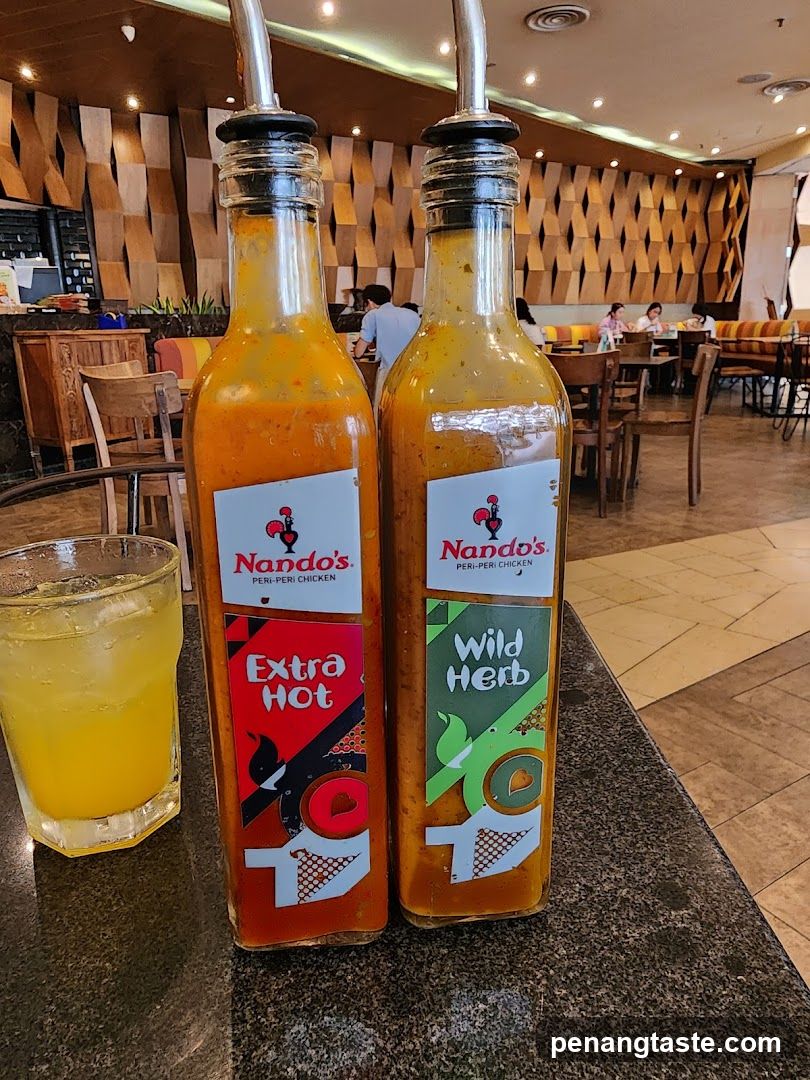 Nando's Sauce Bottles and Drink