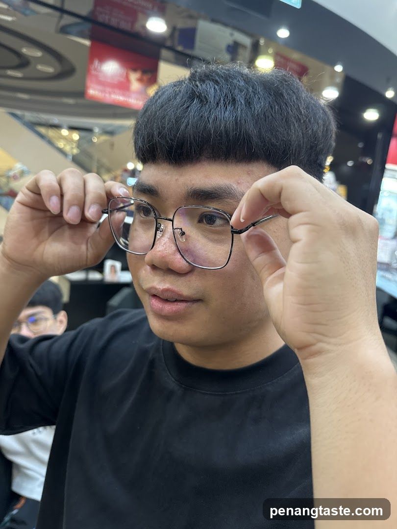 Person Adjusting Glasses in Store Interior