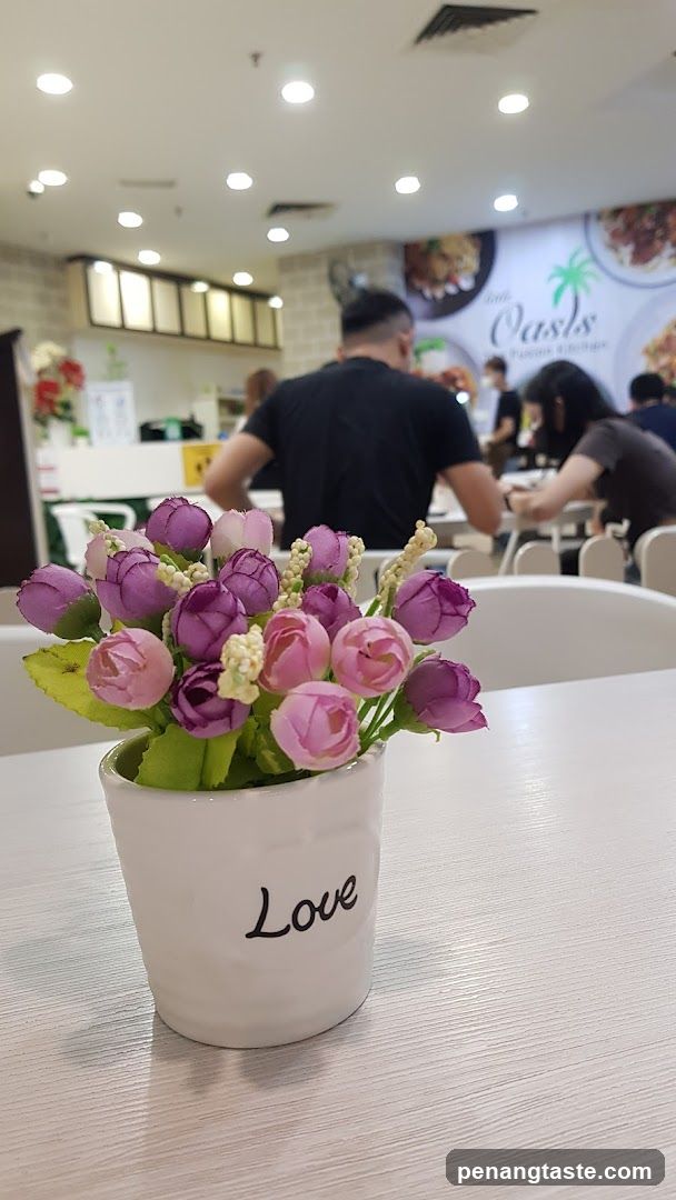 Flower Pot with Pink and Purple Flowers in a Restaurant Interior