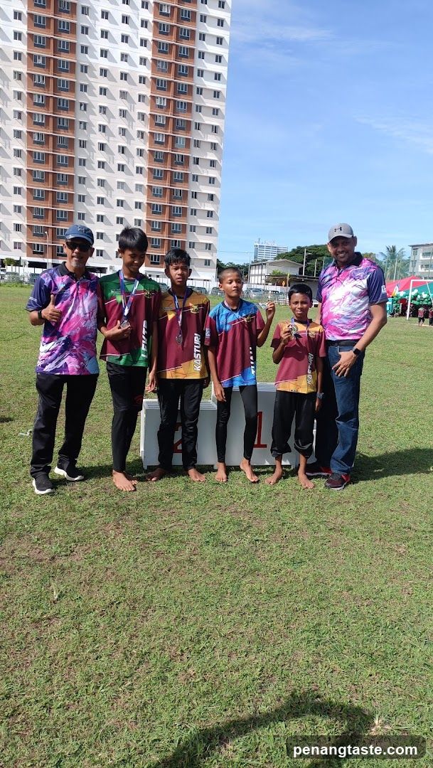 Group of Boys with Medals in Front of Building
