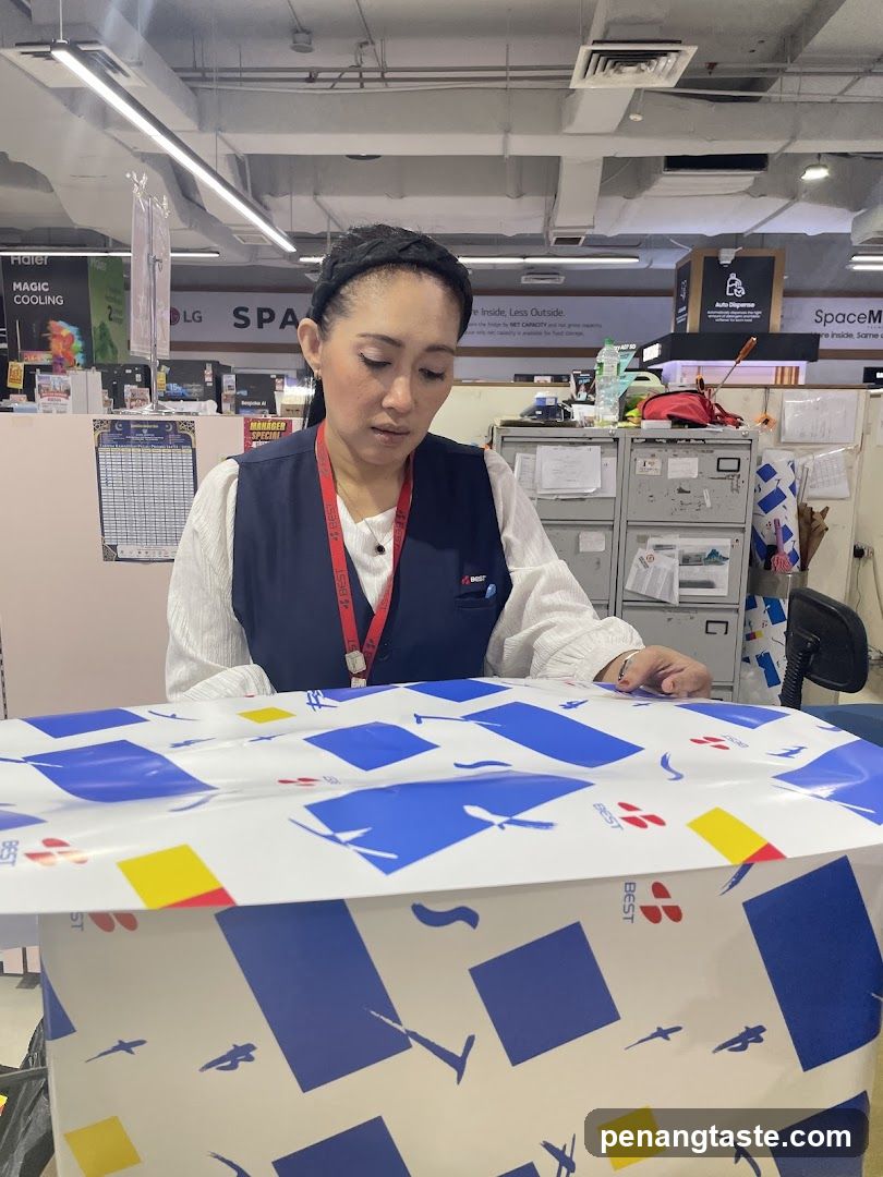 Staff Wrapping a Product in Store