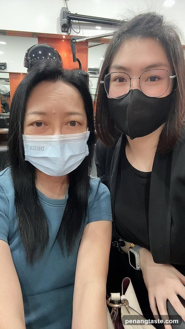 Two women wearing masks indoors