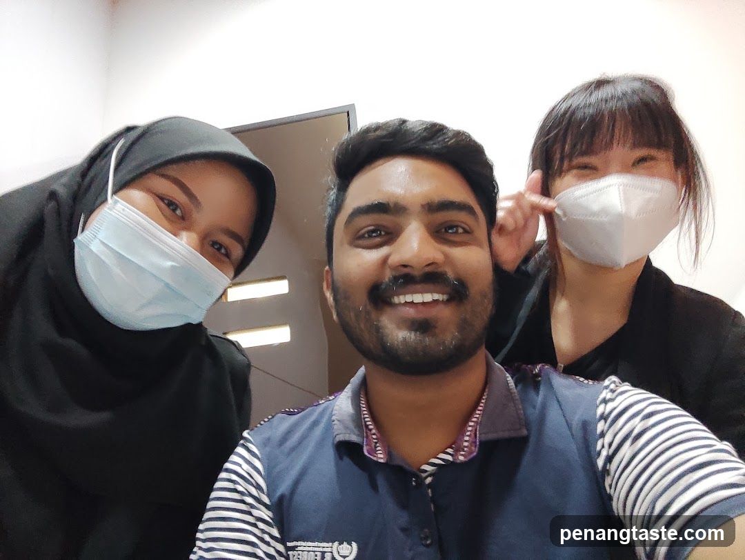 Selfie with staff members wearing masks