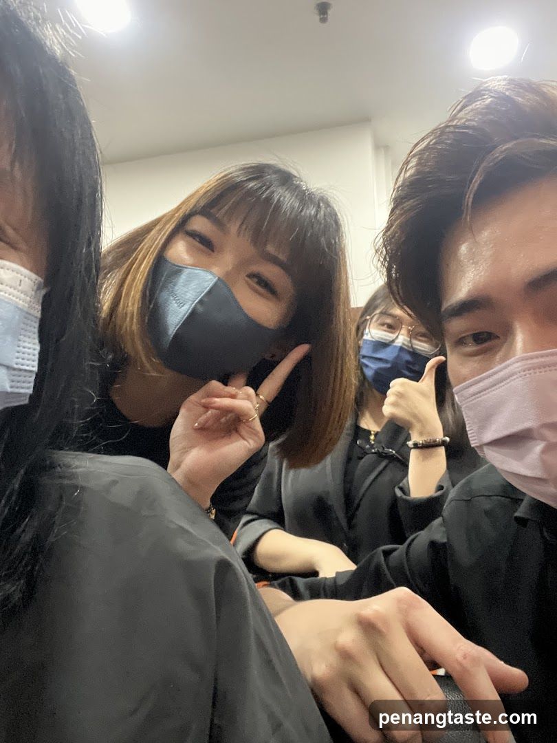 Group selfie indoors with masks