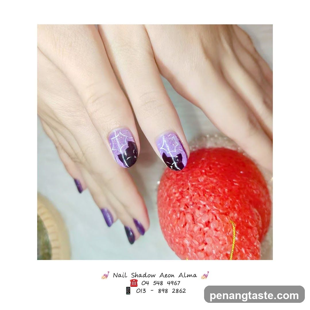 Nail Art Design with Purple and Black Cat Theme
