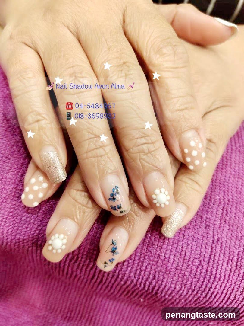 Nail Art Design with Floral and Polka Dot Patterns