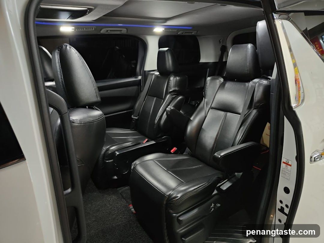 Interior of a luxury vehicle with black leather seats