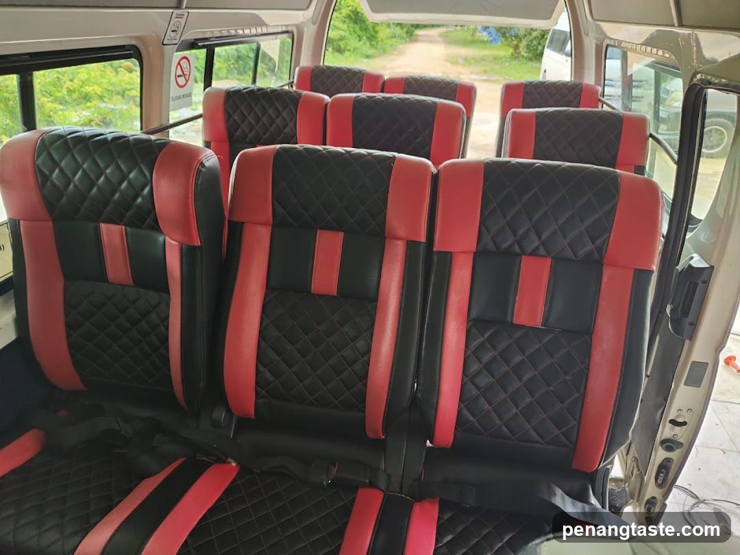 Interior of a vehicle with red and black seats