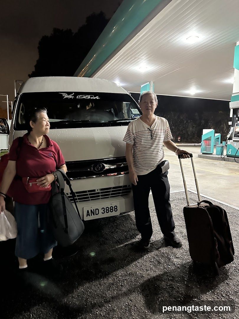 Travelers at Gas Station Night