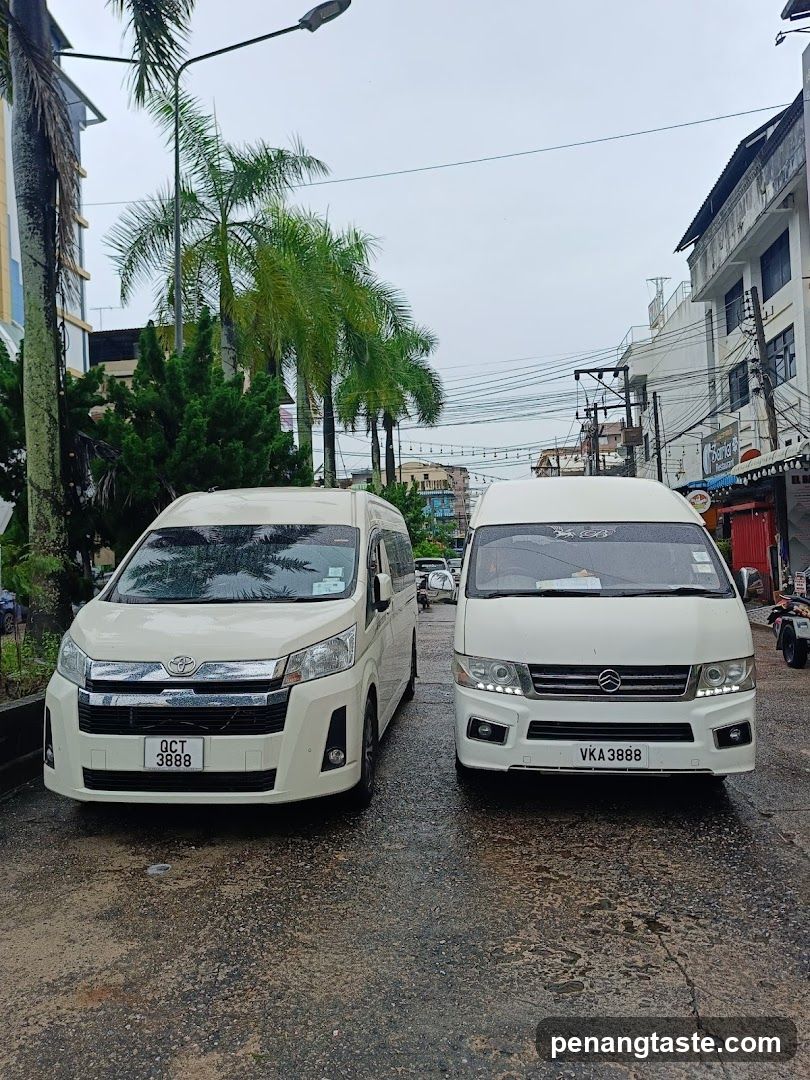 Two white vans parked on a street