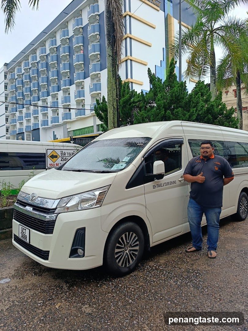 Minivan with driver outside hotel