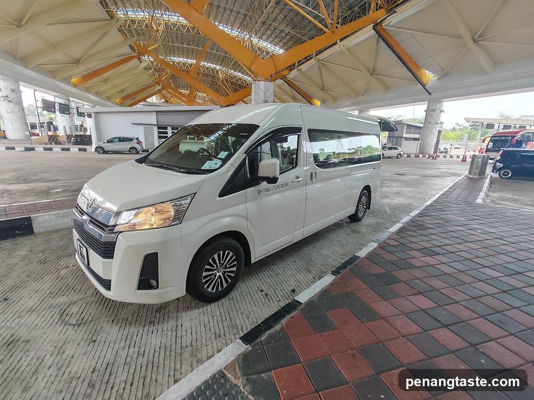 White Toyota Hiace Van at Gas Station