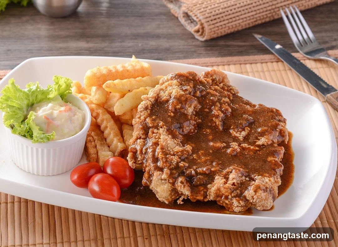 Served Plate of Fried Chicken with Fries and Salad