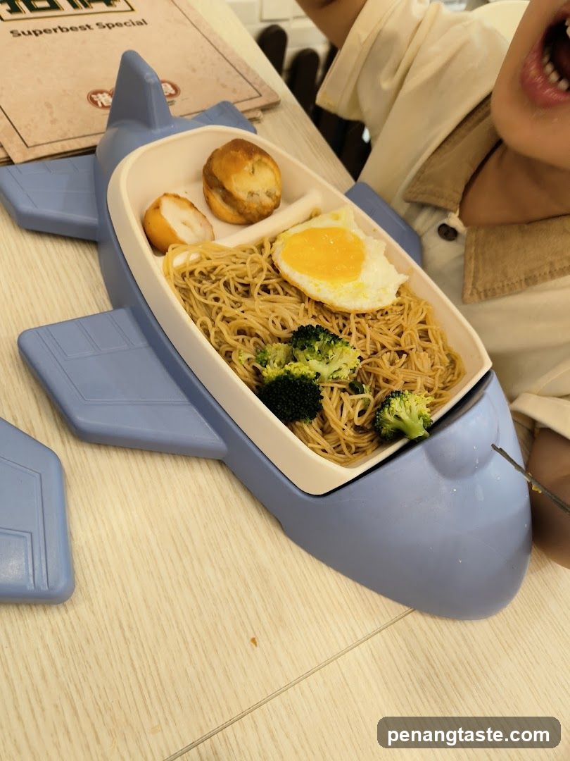 Airplane-shaped meal bowl with noodles and egg