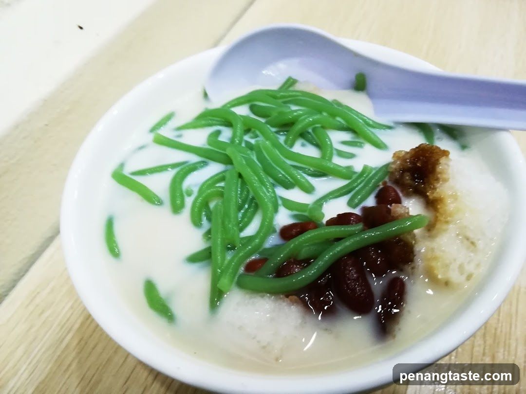 Cendol with coconut milk and toppings