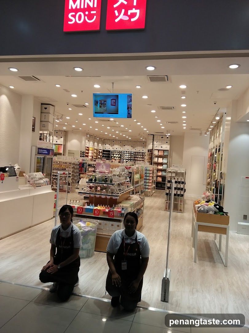MINISO Store Interior with Staff