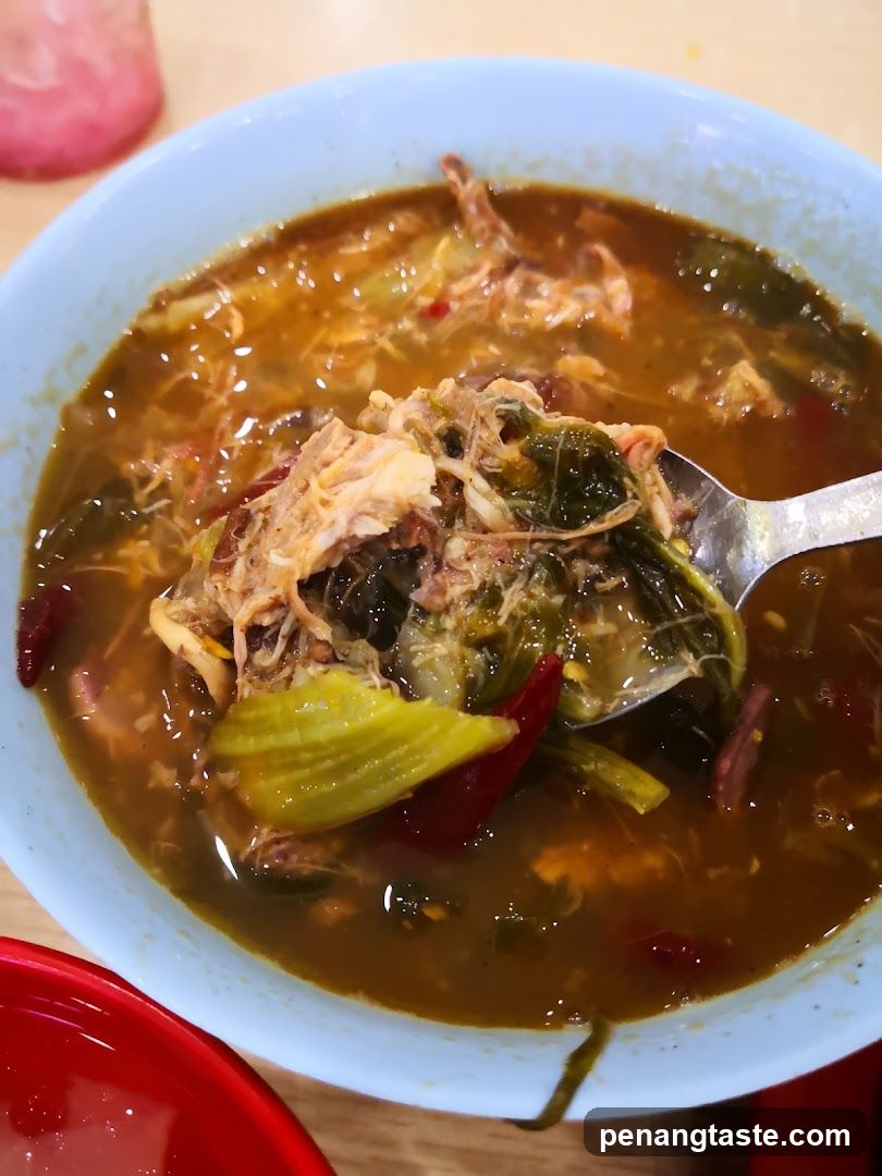 Bowl of Soup with Meat and Vegetables