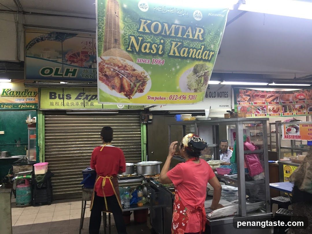 Food Stall Interior with Staff and Signage
