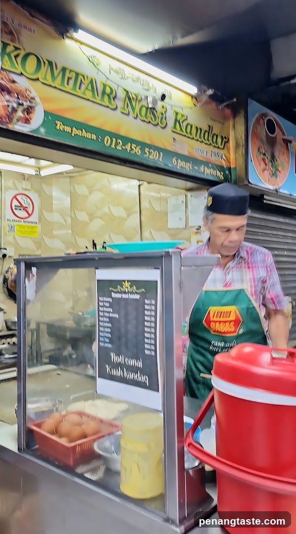 Food Stall Interior with Staff and Equipment