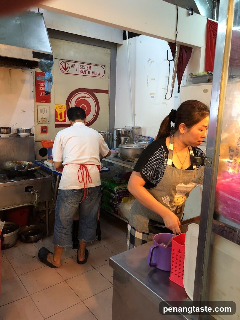 Kitchen Interior with Staff Preparing Food