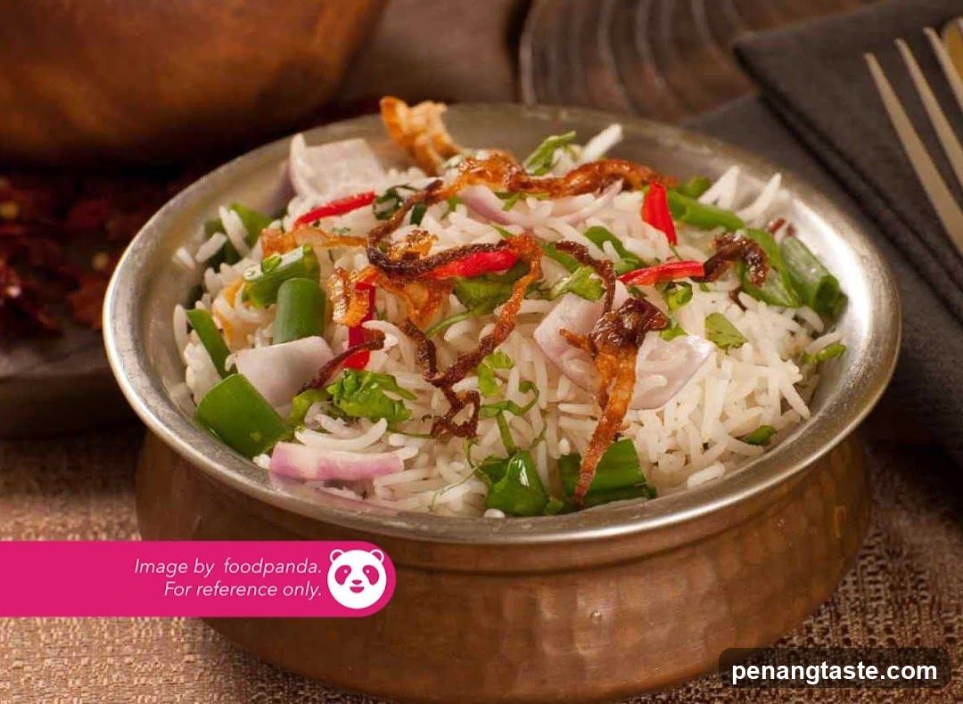 Bowl of Spiced Rice with Vegetables and Fried Onions