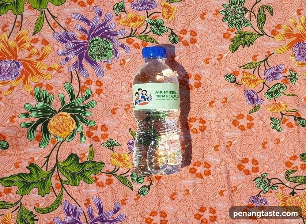 Bottled Water on Floral Fabric