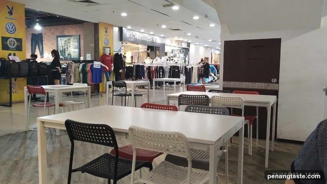 Shopping Mall Interior with Clothing Store and Dining Area