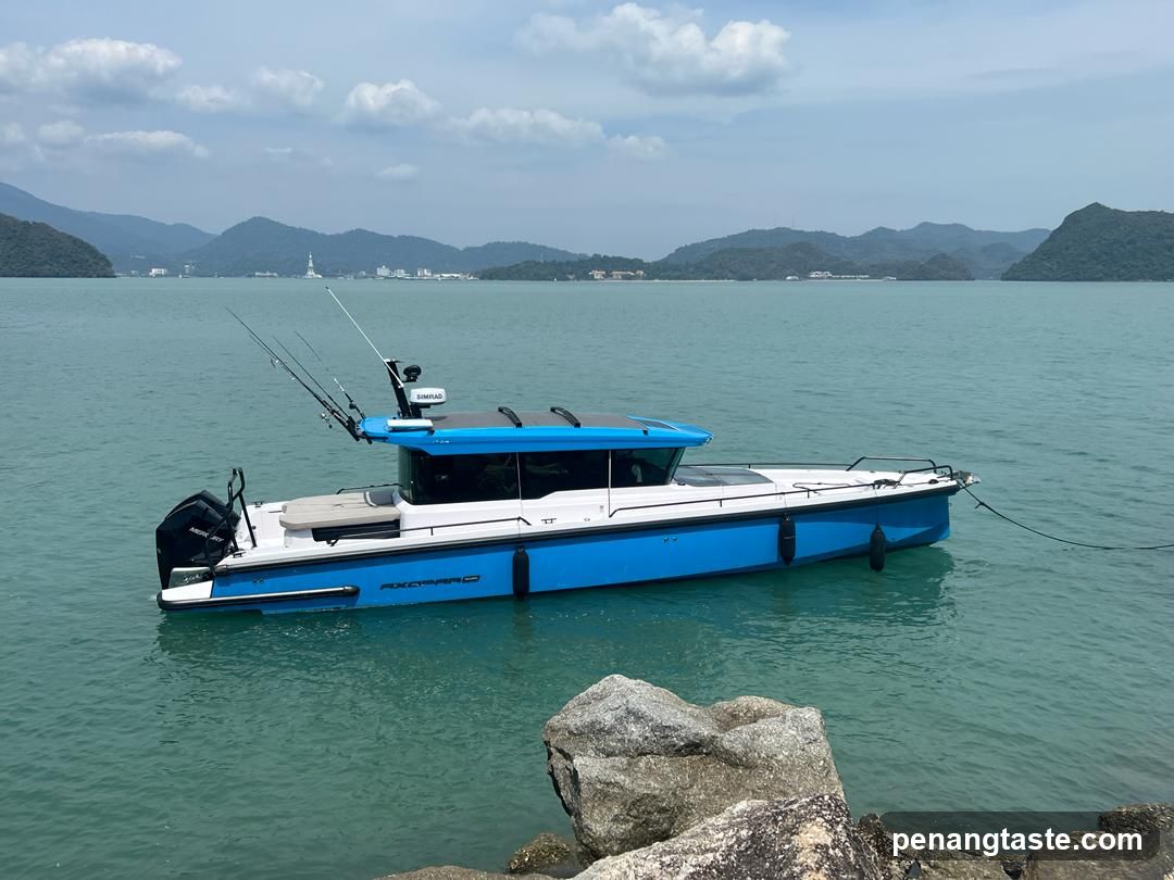 Blue and white fishing boat on calm water