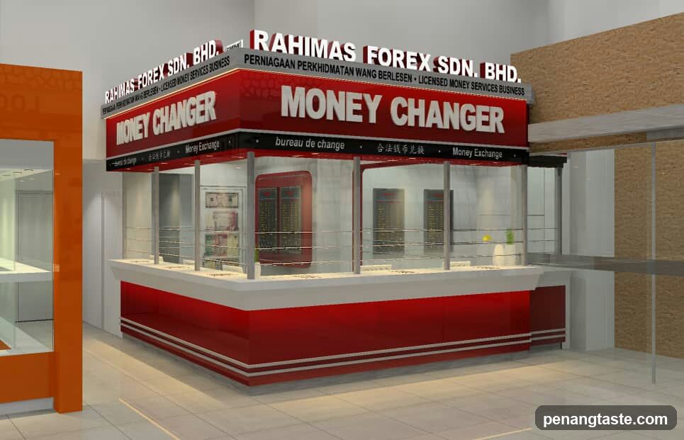 A modern red and white money changer kiosk with visible signage reading 'RAHIMAS FOREX SDN. BHD.' and 'MONEY CHANGER' in multiple languages. The shop features glass display cases, currency exchange boards inside, and bilingual labeling including Malay and English.